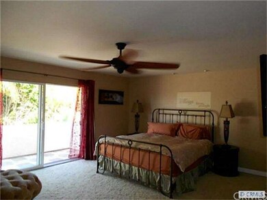 Spacious master bedroom with huge travertine balco