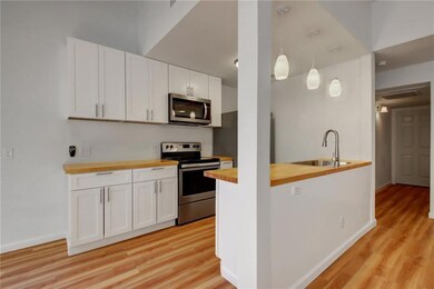 Kitchen with butcher block countertops, appliance