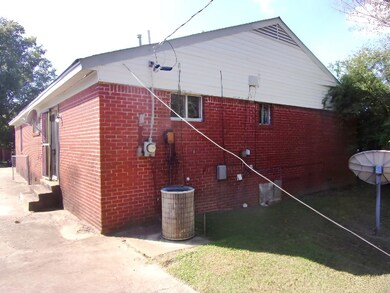 View of property exterior featuring central AC uni
