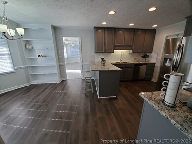 Remodeled eat-in kitchen with bay window, shelving, breakfast bar, WOW!