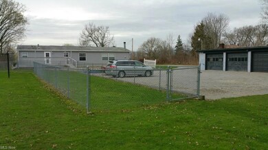 View looking south showing house, garage, large sl