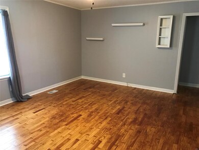 Living room from entrance door with original wood 