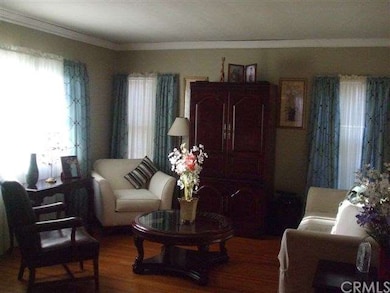 Living Room with hardwood flooring and ample natur