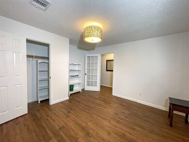 The flex room is right off  the entry and features a French door and a roomy closet.