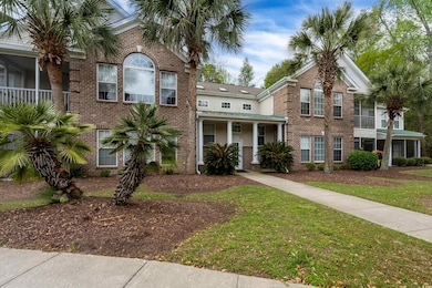 View of front of home featuring a front yard and b