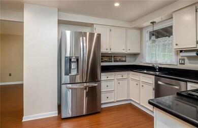 Kitchen and entry way into the family room.