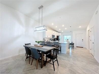 Dining room with light tile patterned flooring and