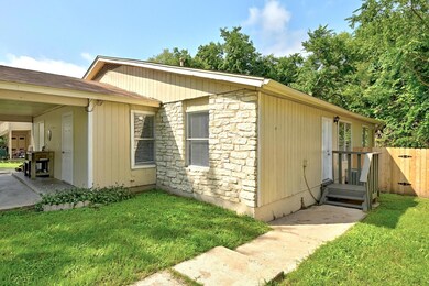 View of side of property with stone siding