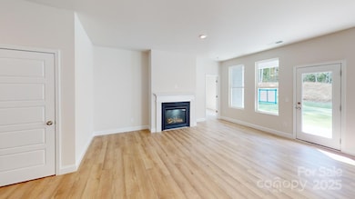 Great room - Photo is representative of a previous home built