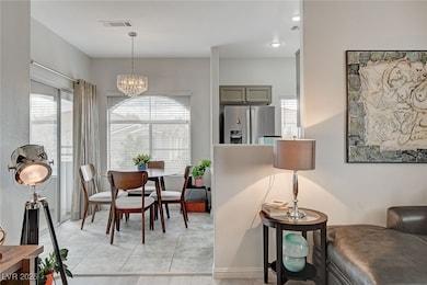 Dining room with an inviting chandelier, plenty of