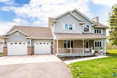 View of front of home featuring a garage, a front 