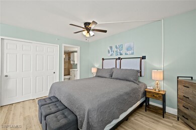 Bedroom featuring baseboards, wood finished floors