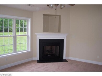 Living Room. Gas log fireplace, vaulted ceiling, new carpet and fresh paint in living room