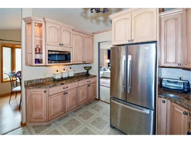 Stainless steel appliances, and birch cabinetry wi
