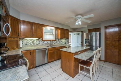The kitchen has been updated with granite counters