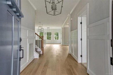 Entry foyer shows off all that wider plank hardwoo
