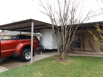 Double-wide driveway and 2-car carport