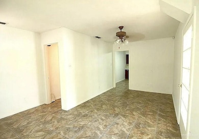 Spare room with a ceiling fan