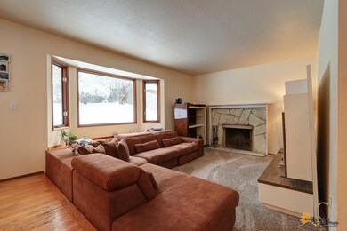 Living room has bay window seat.