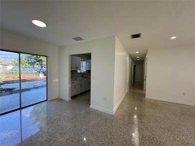 view of Living/Dining area and Hallway to bedrooms