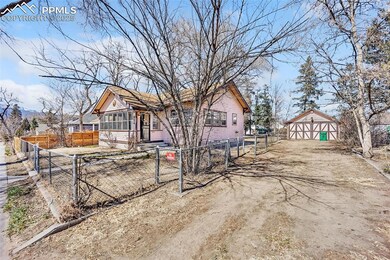 View of Driveway and fenced front yard