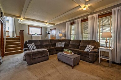 Spacious living room graced with new windows and o