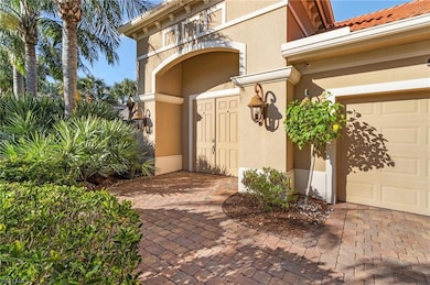 View of exterior entry featuring a garage
