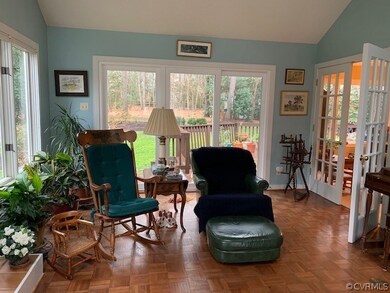 Living room is surrounded by light on all sides.