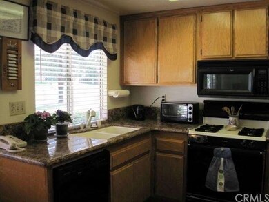Upgraded kitchen with granite countertops and perg