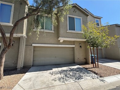Traditional-style home featuring stucco siding, concrete driveway, and a garage