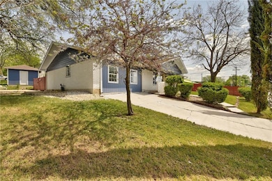 Obstructed view of property featuring a front yar