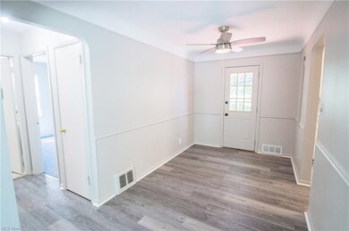Dining Room with new vinyl flooring, new fan, and 