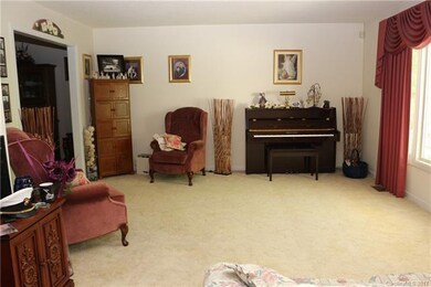 Large formal living room with tons of natural ligh