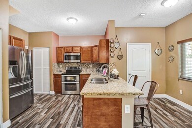 Remodeled kitchen with cherry wood cabinets, stain