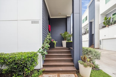 Charming front porch offers a warm welcome to gues