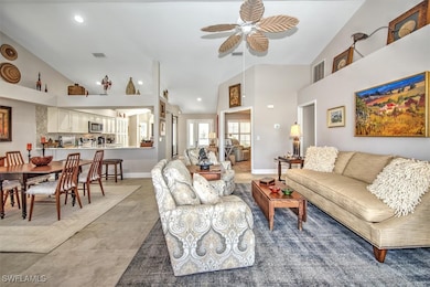Living area with visible vents, baseboards, recess
