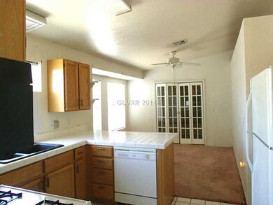Property Photo. View from kitchen into dining area