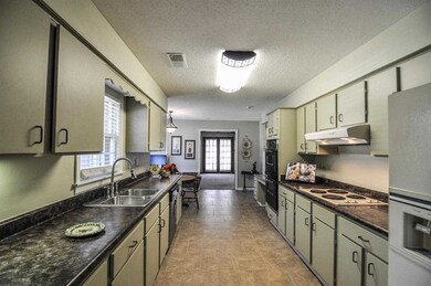Features double oven, dishwasher, new tile floors,