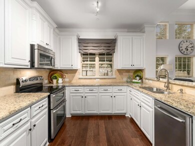 The kitchen showcases granite countertops, painted