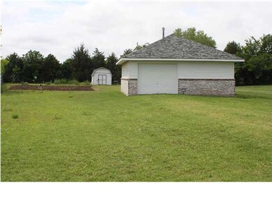 Detached 1car garage with work shop that features 