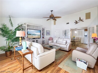 Living room featuring high vaulted ceiling, ceilin