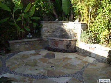 Back courtyard fountain and firepit.