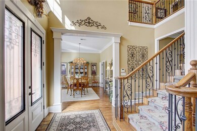 Dramatic two story entry highlighted by neutral to
