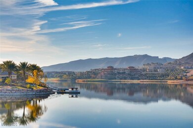 Water view featuring mountains and a boat dock