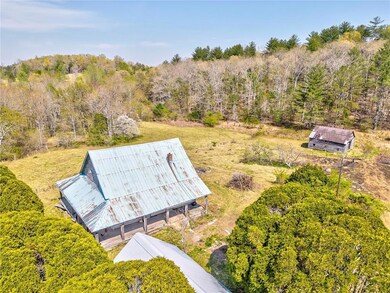 Birds eye view of property with a forest view