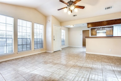 Unfurnished living room featuring light tile patt