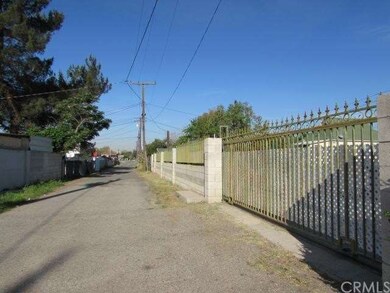 Paved alley running along South side of lot with g