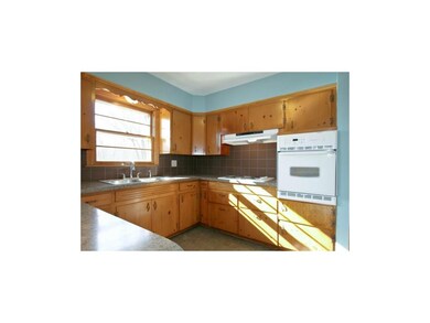 Charming kitchen with lots of cabinets and counter