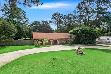 Once acre lot with huge circle driveway and beauti