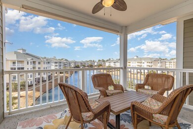 Balcony with ceiling fan and a water view
